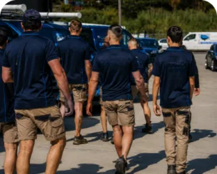 Plumbers walking to their service vans on a Wentworthville job